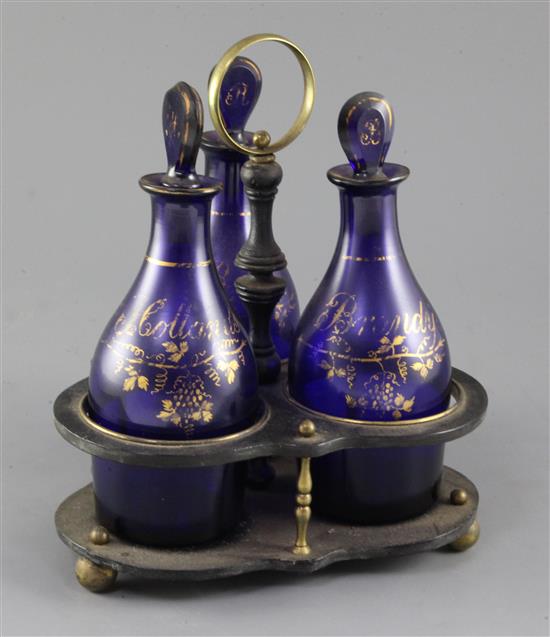 A Regency gilt and blue glass three bottle decanter stand, some wear